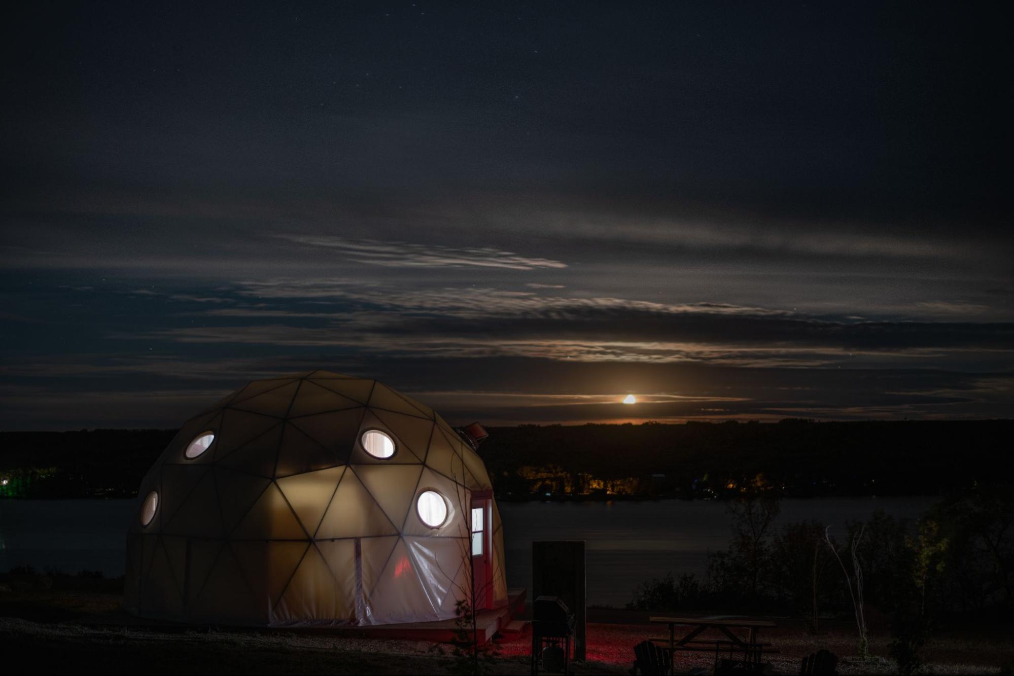 A cozy tent site with a campfire area, located at Buffalo Pound Lake.